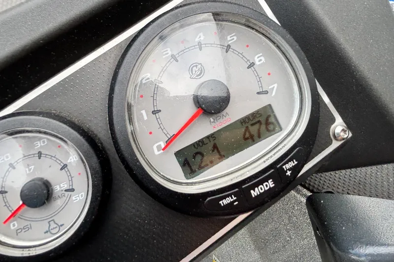 Slide: The Image of Close-up of 2019 Ranger Z520L dashboard gauges showing RPM and engine hours. - 10