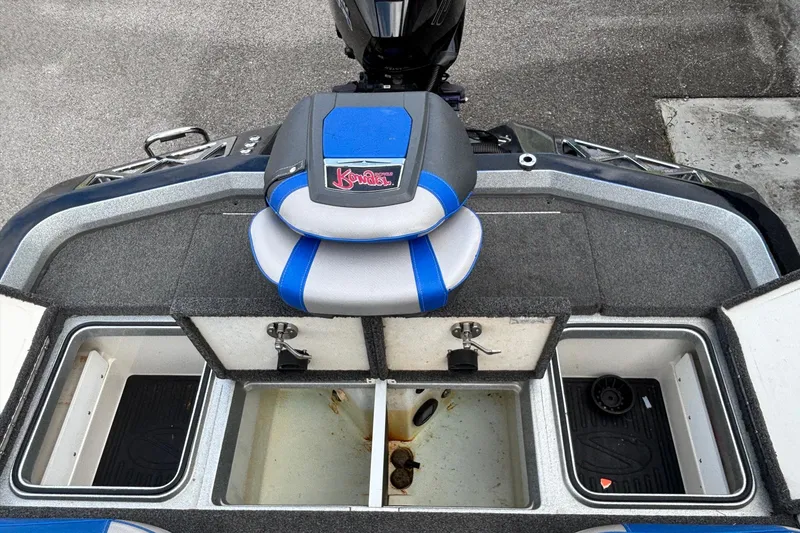 Slide: The Image of 2019 Ranger Z520L boat interior with storage compartments and blue seat. - 13