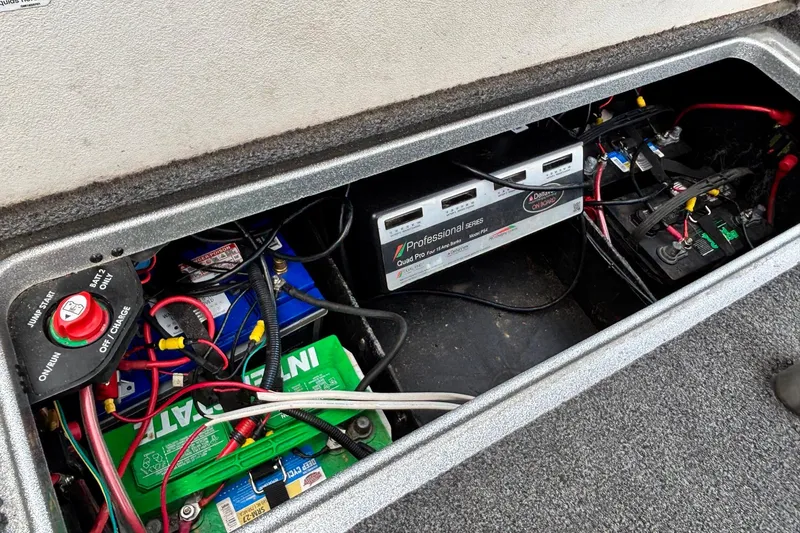 Slide: The Image of 2019 Ranger Z520L boat battery compartment with wiring and charging system. - 14