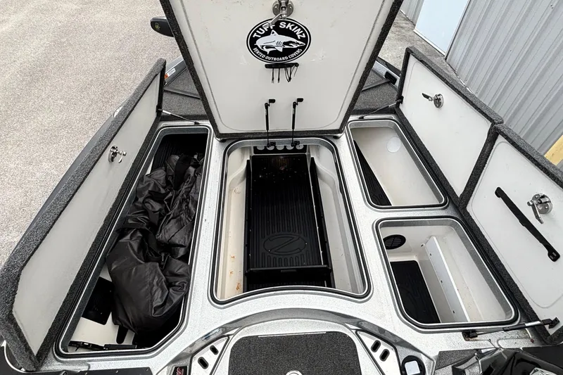 Slide: The Image of 2019 Ranger Z520L boat storage compartments open, showcasing organized interior space. - 7