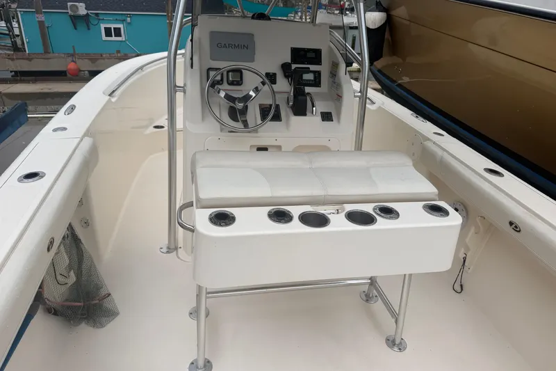 Slide: The Image of 2008 Pursuit C 230 Center Console boat interior with Garmin navigation system. - 10
