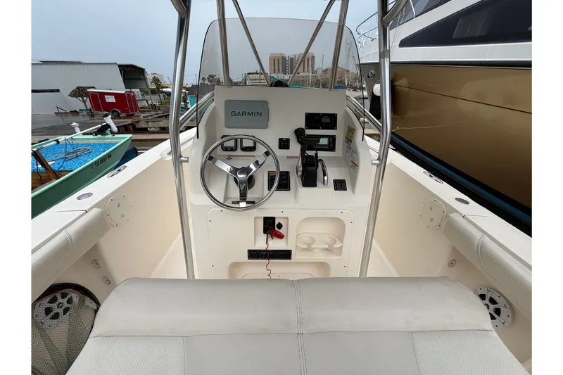 Slide: The Image of 2008 Pursuit C 230 Center Console boat interior with Garmin navigation system. - 11
