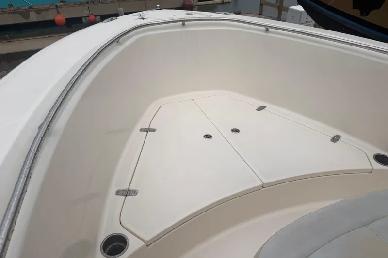 Slide: The Image of 2008 Pursuit C 230 Center Console boat interior with storage compartments. - 13