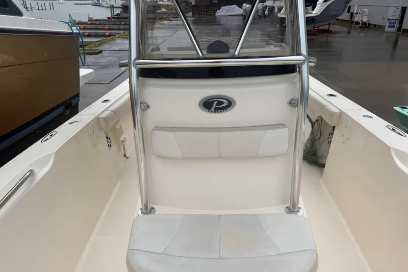 Slide: The Image of 2008 Pursuit C 230 Center Console boat interior with seating and console view. - 14