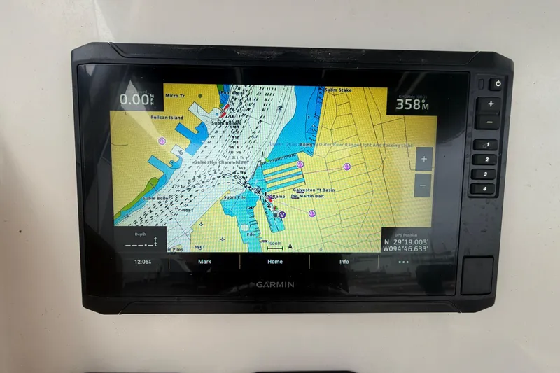 Slide: The Image of Garmin GPS displaying nautical chart on 2008 Pursuit C 230 Center Console boat. - 18