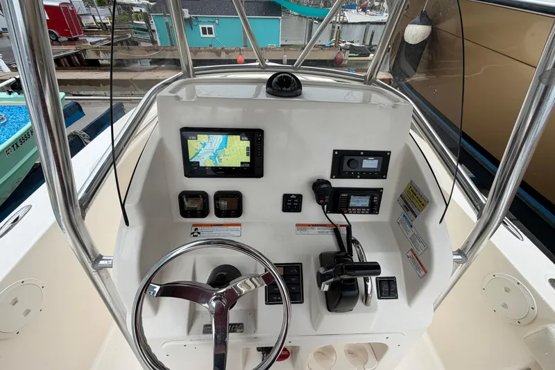 Slide: The Image of Center console of 2008 Pursuit C 230 boat with navigation equipment and controls. - 20