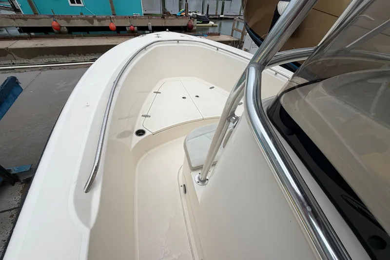 Slide: The Image of 2008 Pursuit C 230 Center Console boat interior with stainless steel railings. - 21