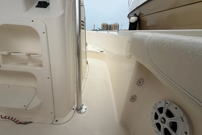 Slide: The Image of 2008 Pursuit C 230 Center Console interior with wet surfaces and speaker detail. - 27