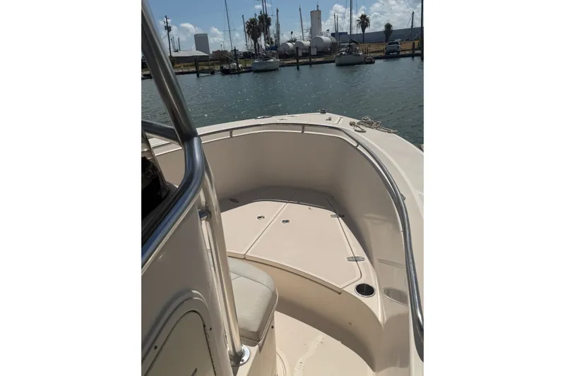 Slide: The Image of 2008 Pursuit C 230 Center Console boat docked in a marina. - 60