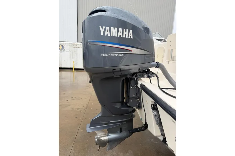 Slide: The Image of Yamaha four-stroke outboard motor on 2008 Pursuit C 230 Center Console boat. - 32