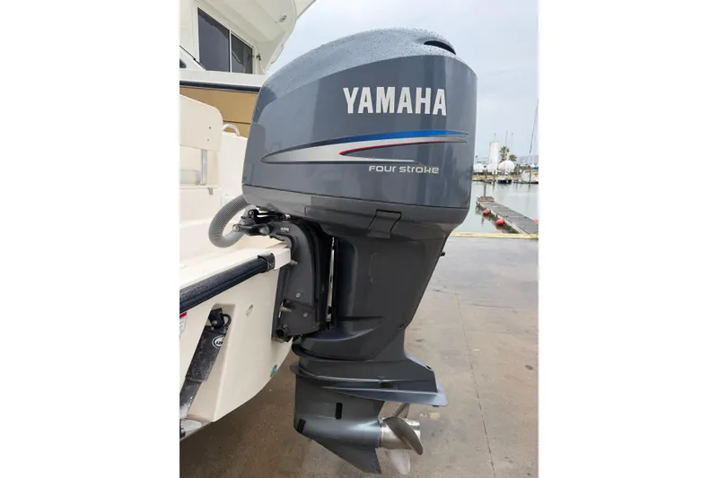 Slide: The Image of Yamaha four-stroke outboard motor on 2008 Pursuit C 230 Center Console boat. - 33
