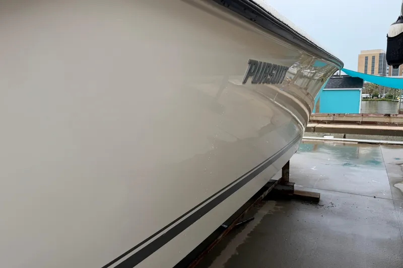 Slide: The Image of 2008 Pursuit C 230 Center Console boat docked, side view. - 34