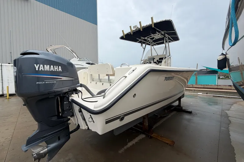 Slide: The Image of 2008 Pursuit C 230 Center Console boat with Yamaha four-stroke engine on display. - 4