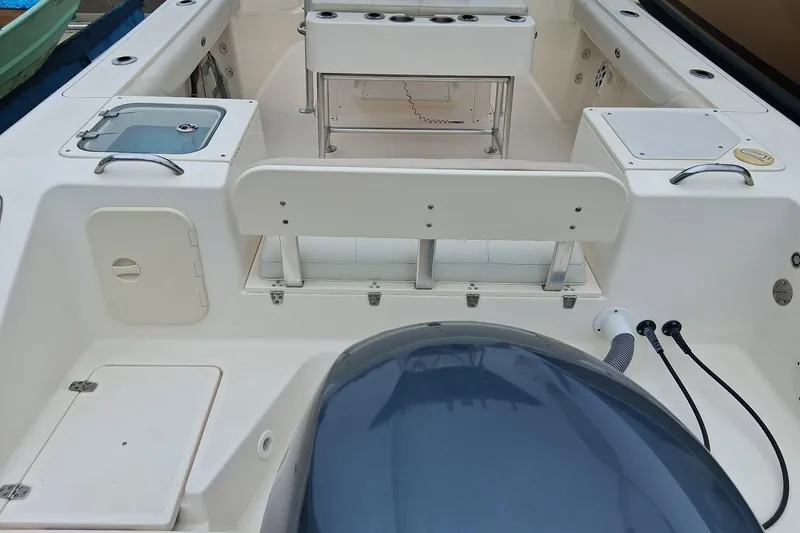 Slide: The Image of 2008 Pursuit C 230 Center Console boat interior with seating and storage compartments. - 5