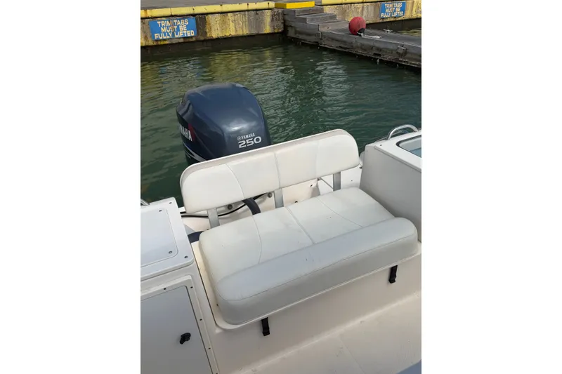 Slide: The Image of 2008 Pursuit C 230 Center Console boat with Yamaha 250 engine at dock. - 55