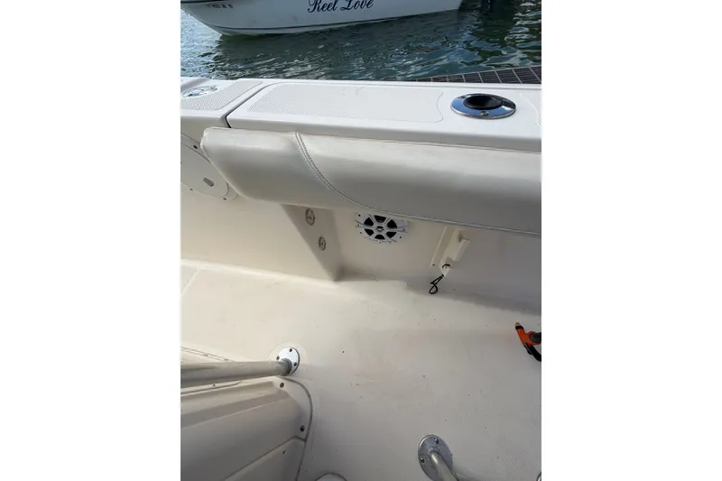 Slide: The Image of 2008 Pursuit C 230 Center Console boat interior with seating and speaker. - 57