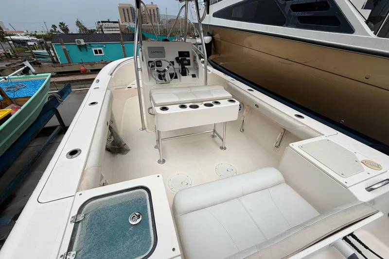 Slide: The Image of 2008 Pursuit C 230 Center Console boat interior with steering wheel and seating. - 7