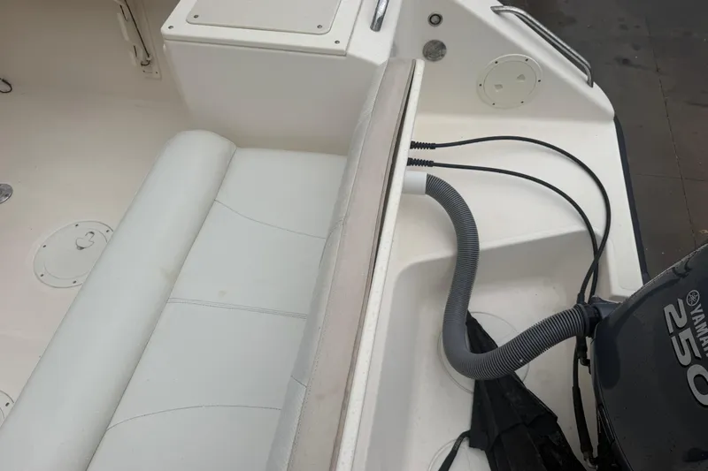 Slide: The Image of 2008 Pursuit C 230 Center Console boat interior with Yamaha engine. - 9