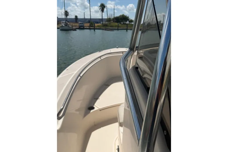 Slide: The Image of 2008 Pursuit C 230 Center Console boat docked in sunny marina. - 61