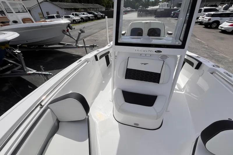 Slide: The Image of Interior view of 2026 Tidewater 210 LXF boat on a parking lot. - 10