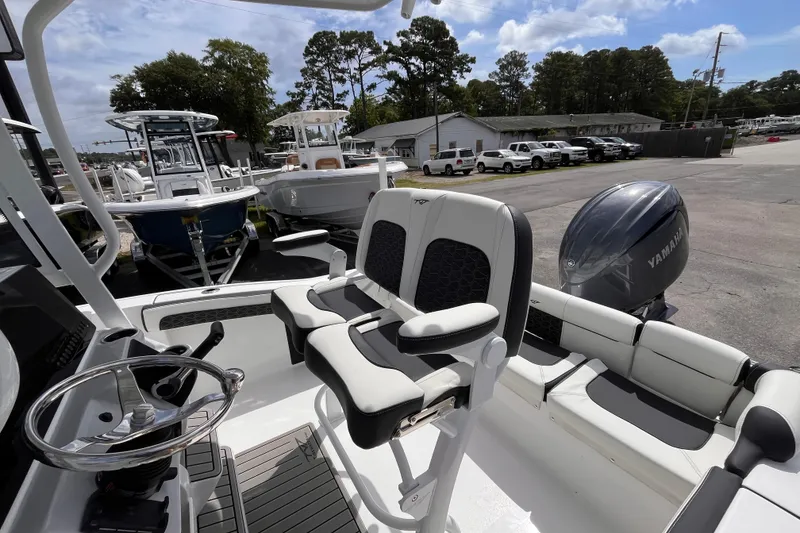 Slide: The Image of 2026 Tidewater 210 LXF boat with Yamaha engine, featuring sleek seating and modern design. - 14