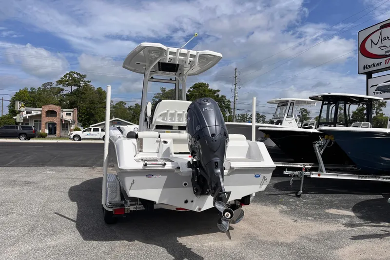 Slide: The Image of Tidewater 210 LXF 2026 boat with outboard motor in parking lot. - 3