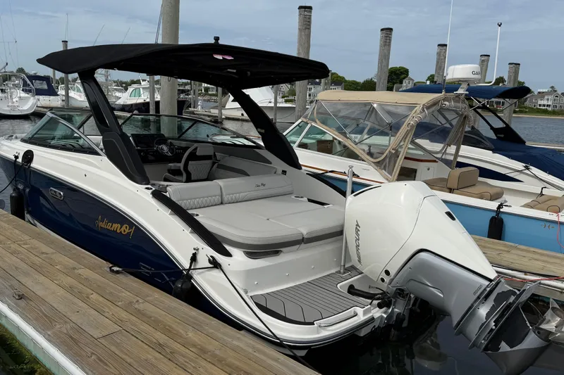 The Image of 2023 Sea Ray SLX 260 Outboard at dock, luxurious design. - 0
