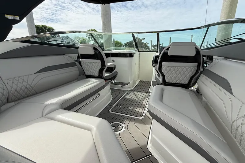 Slide: The Image of Interior of 2023 Sea Ray SLX 260 Outboard with luxurious seating. - 11