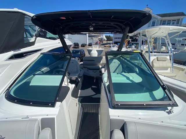 Slide: The Image of 2023 Sea Ray SLX 260 Outboard with open cockpit and sunshade. - 15