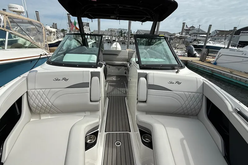 Slide: The Image of Interior of 2023 Sea Ray SLX 260 Outboard with luxurious seating. - 16