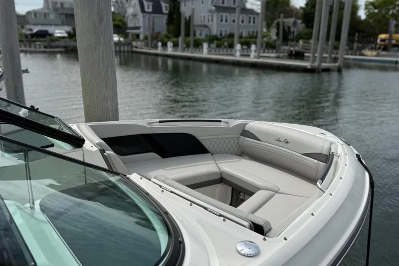 Slide: The Image of 2023 Sea Ray SLX 260 Outboard boat at dock. - 17