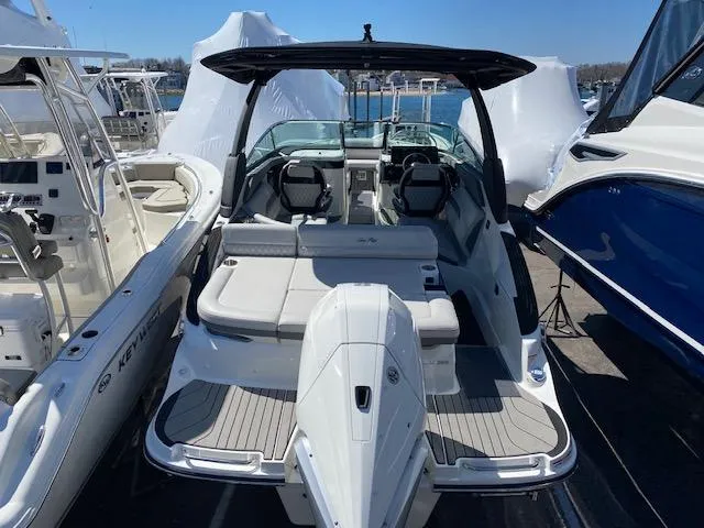 Slide: The Image of 2023 Sea Ray SLX 260 Outboard boat at marina. - 23