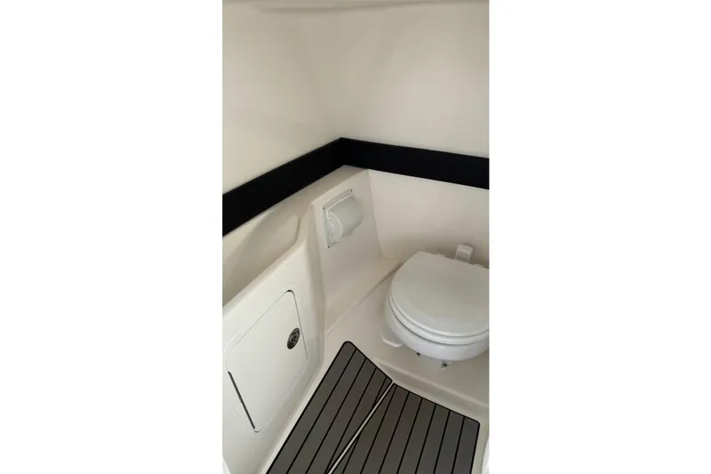 Slide: The Image of Interior of 2023 Sea Ray SLX 260 Outboard with toilet. - 27