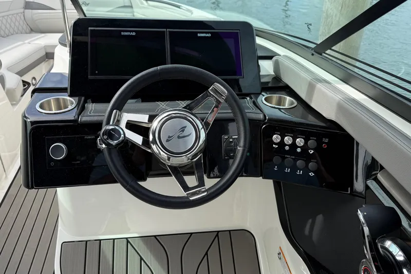 Slide: The Image of 2023 Sea Ray SLX 260 Outboard helm with modern controls. - 28