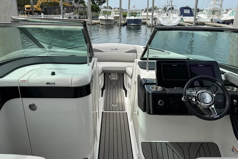 Slide: The Image of Interior view of 2023 Sea Ray SLX 260 Outboard at dock. - 29
