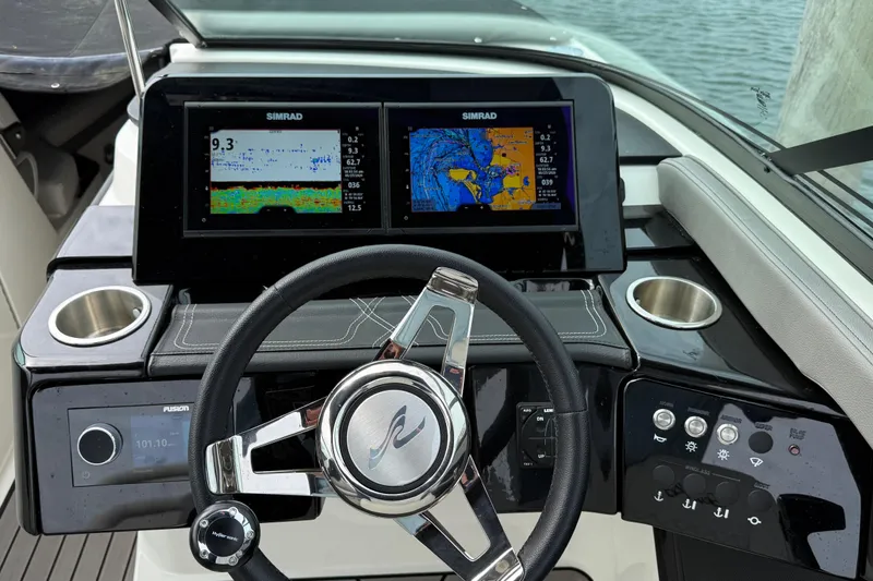 Slide: The Image of 2023 Sea Ray SLX 260 Outboard helm with dual Simrad displays. - 7