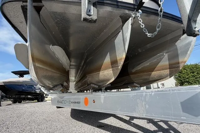 Slide: The Image of 2023 Barletta L23U pontoon boat on a trailer, underside view. - 10