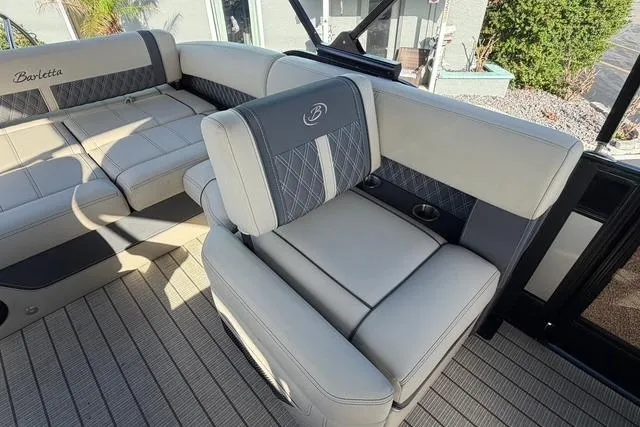 Slide: The Image of 2023 Barletta L23U boat interior with luxurious seating and elegant design. - 14