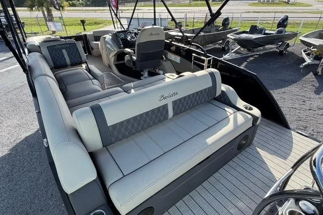 Slide: The Image of 2023 Barletta L23U pontoon boat with luxurious seating and modern design. - 17