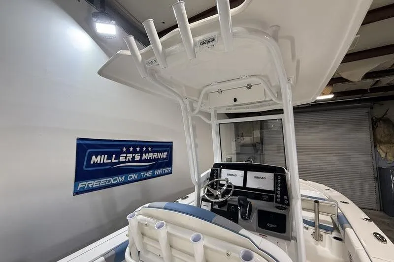 Slide: The Image of Interior view of 2026 Robalo 246 Cayman boat at Miller's Marine. - 14