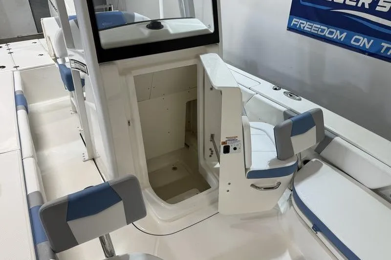 Slide: The Image of 2026 Robalo 246 Cayman boat interior with open storage compartment and seating. - 20