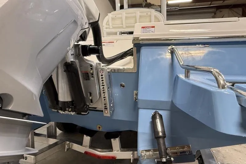 Slide: The Image of Robalo 246 Cayman 2026 boat hull and engine view. - 5