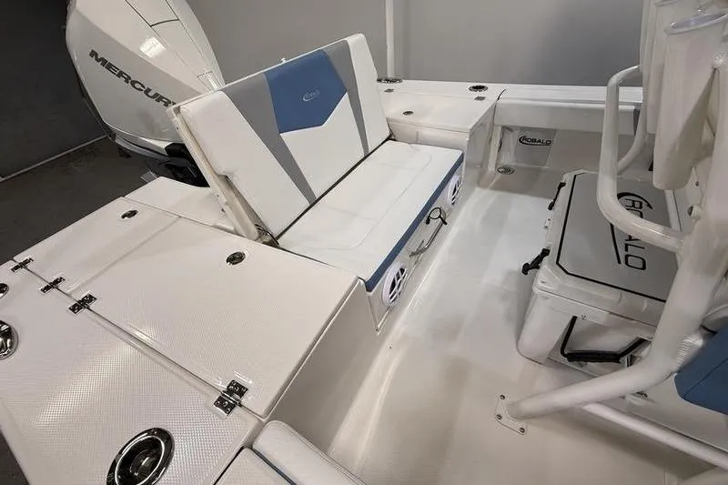 Slide: The Image of 2026 Robalo 246 Cayman boat interior with seating and Mercury engine. - 6