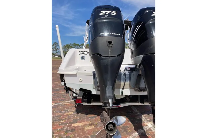 Slide: The Image of 2005 Donzi 35 ZF Daytona with twin 275 supercharged engines, rear view on brick pavement. - 12