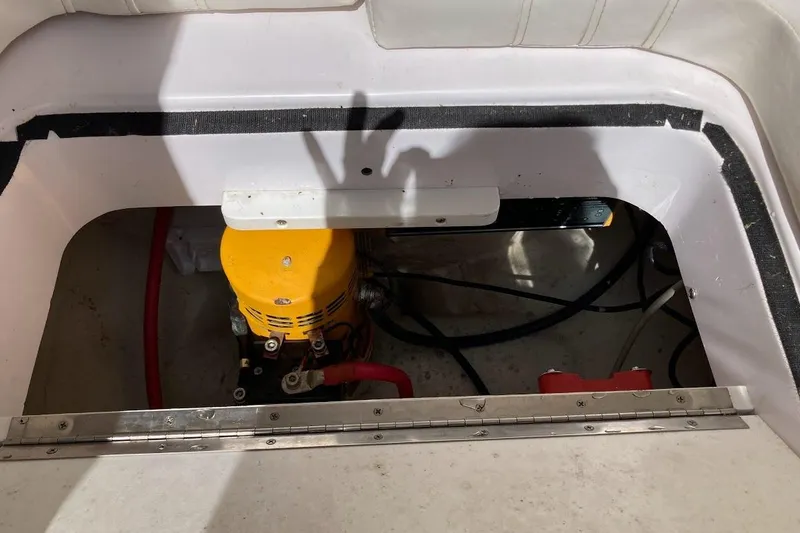 Slide: The Image of 2005 Donzi 35 ZF Daytona engine compartment with visible yellow machinery and wiring. - 19