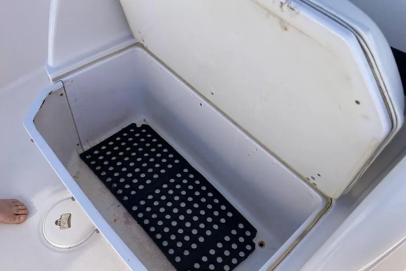 Slide: The Image of Open storage compartment on 2005 Donzi 35 ZF Daytona boat with black mat inside. - 25