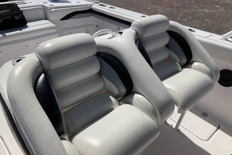 Slide: The Image of Luxury seating on a 2005 Donzi 35 ZF Daytona boat, featuring plush white upholstery. - 30