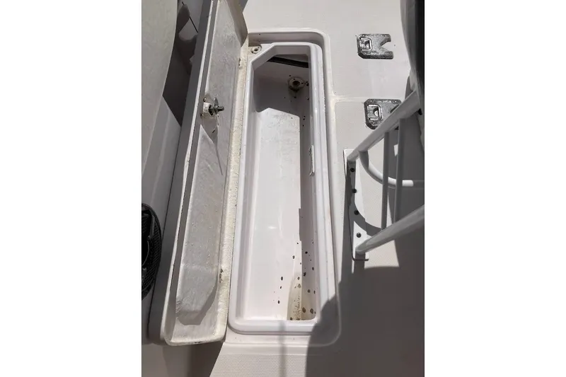 Slide: The Image of Open storage compartment on a 2005 Donzi 35 ZF Daytona boat deck. - 32
