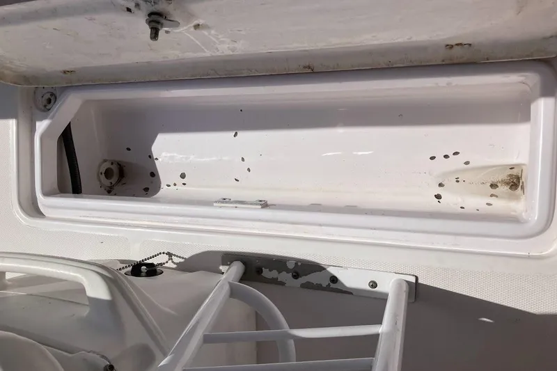 Slide: The Image of Storage compartment of a 2005 Donzi 35 ZF Daytona boat, showing interior details. - 34