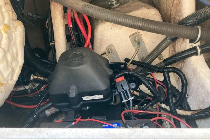 Slide: The Image of Engine compartment of a 2005 Donzi 35 ZF Daytona with visible wiring and components. - 38